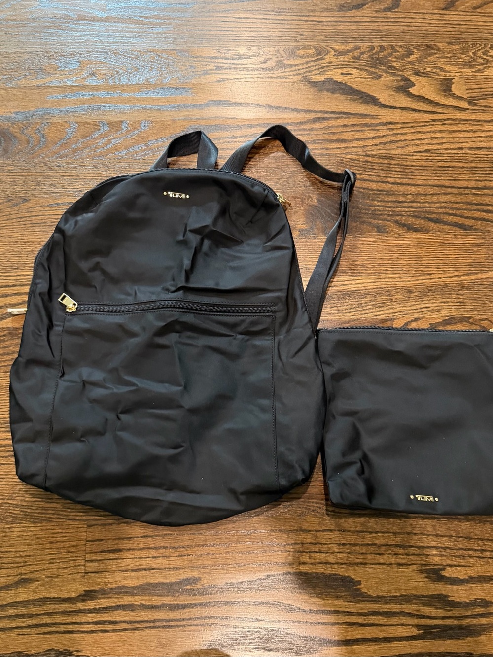 Tumi Black Nylon Backpack with Matching Pouch and Gold Accents